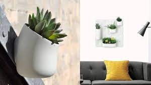 If You Don T Have Enough Room In Your Home To Grow Plants Horizontally And Are Forced To Retire Your Green Thumb Plant Wall Living Green Walls Interior Plants