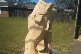 Alba man has 5-foot-tall bass carved out of tree stump