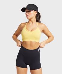 For You For Yours Body Fit Low Support Removable Padding Plunge V Shape Neckline Non Adjustable Elastic Straps Sports Bra Yellow Sports Bras Gymshark