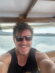 Are members in Thailand for holiday or living, and are any members part of  the Rotary Club?