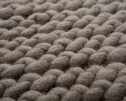This lovely rug is made from leftover chunky wool. Natural Grey Color Woolen Crochet Rug