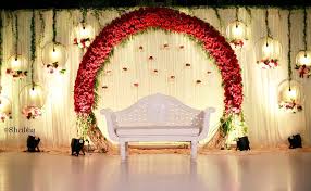 With careful planning and coordination, however, a barn can go from rustically simple to romantically gorgeous. A Red Floral Arch For An Outdoor Wedding Shribha Shribhaweddings Stagedecor Chen Wedding Stage Decorations Wedding Stage Backdrop Wedding Hall Decorations