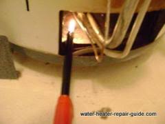 How to light a water heater pilot light open the door/cover over the pilot light access. Lighting Water Heater