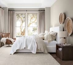She verbalized that she wanted the focal point to be her new bed and she had one specific request: Antique Bronze Curtain Rod Wall Bracket Pottery Barn