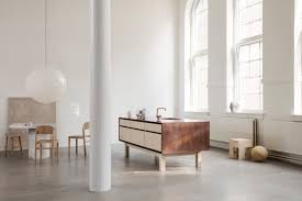 framed kitchen combines timber, copper