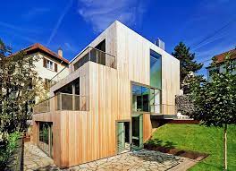 staggered timber clad haus am hang by mvrdv climbs a stuttgart slope like stairs architecture house architecture house exterior