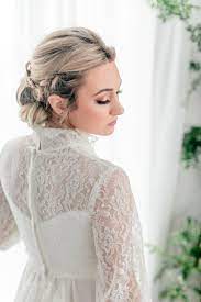 Vintage Bride On Bridal Couch With A Flower Wall Long Hair Wedding Styles Blonde Bride Bride Hairstyles