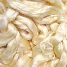Silk is an elastic fibre and may be stretched from silk has a liability and suppleness that, aided by its elasticity and resilience, gives it excellent drapability. Eri Silk Natural Yellow Fibres The Handweavers Studio Gallery