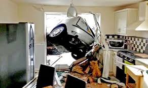 car smashes through kitchen wall