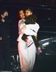 Read details about her husband and vote below for your favorite man for the beautiful kylie kylie jenner (kylie kristen jenner) is an american reality television personality, model, entrepreneur, socialite, and social media personality. Kylie Jenner Rocks An Oversized White Sweatsuit With Her Daughter Stormi Two In Her Arms In Aspen Daily Mail Online