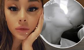 Ariana Grande passionately kisses her real estate beau Dalton Gomez