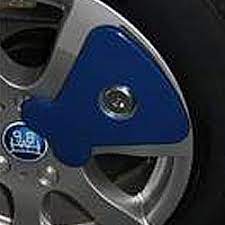 Once the wheel is jacked up and lined up with the chassis receiver, a locking plate is fitted through the wheel to lock it in place. Touring Caravan Axle Wheel Locks