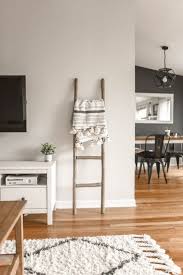 A white fireplace and ceiling beams balance dark walnut floors. How To Choose Gray Paint Colors Accent Colors For Rooms