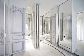 Gilded lounge artistic pretence is given perfect expression in this suite, whose walls are covered with wallpaper made from black and white photographs of the gilded lounge. Maison Margiela Milan Flagship Attitude Interior Design Magazine