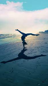 Gymnastics On The Beach Beach Gymnastics Gymnastics Wallpaper Gymnastics Poses