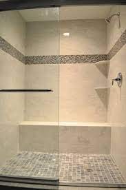 Blue glass tile border in shower is an alternative to the typical accent strip. 24 Glass Tile Shower Ideas Shower Tile Bathrooms Remodel Tile Bathroom