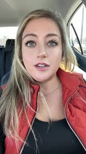 Blonde in Red Jacket Shares Daytime Thoughts in Car