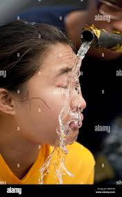 Petty Officer 2nd Class Jessica Saunders, of Belfast, Maine, walks through  the Hall of Heroes aboard the USS Cole