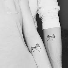 These sweet best friend tattoos depict two little girls listening to each other through the old tin can telephone. 72 Creative Matching Best Friend Tattoos That Are Super Cute Ecemella