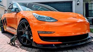 This Orange Wrapped Tesla Model 3 Looks Alluring