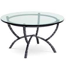 Contemporary wrought iron coffee table with distressed and hand painted borders to the globalized glass rectangular top set on an openwork base. Hudson 36 In Round Wrought Iron Cocktail Table