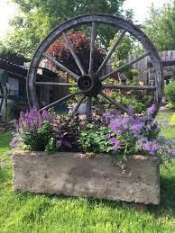 Here is a speed build with this wheels. Pin By Over On Best Flower Bed Tips Wheel Decor Wagon Wheel Decor Rustic Garden Decor