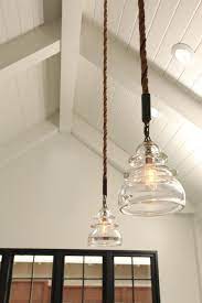 Country Style Pendant Lighting Adds A Rustic Warmth To This Transitional Farmhouse Farmhouse Pendant Lighting Farmhouse Light Fixtures Farmhouse Bathroom Light