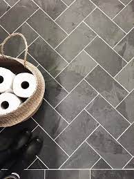 Gray slate mosaic with dark charcoal grout / picking the right grout made easy all your questions answered. Laundry Room Features A Black Slate Herringbone Tiled Floor Accented With White Grout Boys Bathroom In 2019 Room Tiles Herringbone Tile Floors Kitchen Tiles