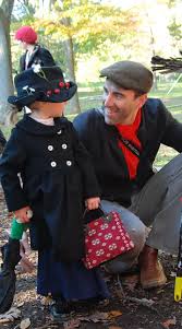 Cyclists on a tandem bike. Happy Halloween Buzzmills