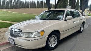 Image result for Medium Gold 1998 Town Car