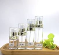 Skincare Packing Set Cosmetic Cylindrical Glass Body Lotion Bottle With  Golden Electroplated Closure and White Pump