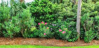 Just the right height to make al fresco diners feel less exposed, the slatted wood panels are cleverly mounted to the foundation. 6 Cost Considerations For Installing A Natural Privacy Fence