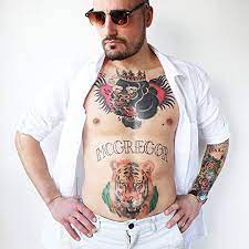 Mcgregor has a silverback gorilla wearing a crown and holding a heart in its mouth. Amazon Com Conor Mcgregor Tattoos Full Set Conor Mcgregor Temporary Tattoo Full Set Beauty