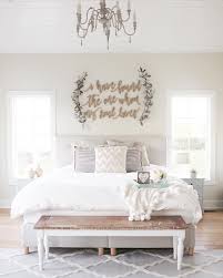 Gingham bedding, wicker baskets, and a white wooden bed give even a city bedroom a farmhouse feel. Farmhouse Master Bedroom Wall Decor Novocom Top