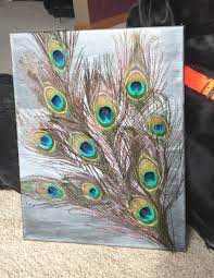 Peacock Feather Modge Podge Prog Painted My Canvas And Used Mp To Secure Feathers Going In My Peacock Th Peacock Crafts Feather Crafts Peacock Feather Decor