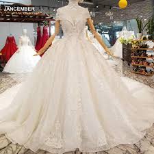 Delicate lace, flowy tulle, metallic bling bling. Ls335100 Collar Chain Decorate Like White Wedding Gowns With High Necklace Cap Sleeve Bride Wedding Dresses 2020 Best Seller Wedding Dresses Aliexpress