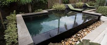 The decor of this small swimming pool looks so beautiful with its earthy landscaping which includes rocks, grass field base of the backyard some greeneries, and trees. Mini Backyard Swimming Pools Makeover Ideas Small Pools