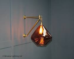 The Vita Smoked Brown Glass Wall Light This Large Shade Casts A Beautiful Rippled Shadow Effect Across Walls Creating A Un Glass Wall Lights Wall Lights Light