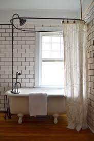 Installing a clawfoot tub shower rod adds aesthetic value to a bathroom. 7 Things You Need To Know About Your Clawfoot Tub Shower The White Apartment