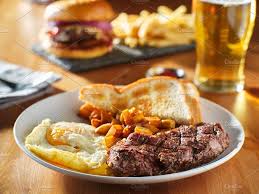 Steak And Eggs Breakfast With Toast Eat Breakfast Breakfast Meals