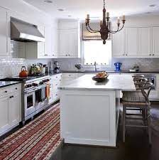 Kitchen islands with seating overhang white. White Kitchen Island With Gray Wishbone Counter Stools Transitional Kitchen