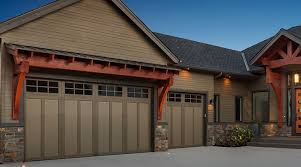 Blue and orange nursery features walls painted blue, sherwin williams riverway, lined with a light gray crib, bassett chesapeake full panel crib, dressed in white and gray crib bedding flanked by windows dressed in orange and turquoise blue curtains, dwellstudio vintage plumes fabric. Garage Door Paint Color Inspiration Sherwin Williams