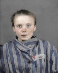 In a haunting black-and-white photograph captured in 1945, a Polish woman  clutches her face and weeps uncontrollably — her tears a raw, unfiltered  expression of trauma, survival, and sudden release. After years