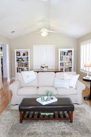This layout encourages socializing better than most; The Best Affordable Slipcovered Sofas Of 2021