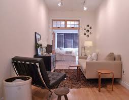 Because of its central placement, it's often referred to as a center table and can serve as the focal point of the room. Downsizing Design 5 Tips For Planning Your Smaller Living Room Living Room Without Coffee Table Small Room Design Living Room Furniture Arrangement