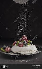 Fill the center of the meringue with whipped cream, and top with kiwifruit slices. Pavlova Meringue Cake Image Photo Free Trial Bigstock