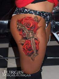 Guns and roses tattoo meaning. 137 Fantastic Gun Tattoos That Hit Their Mark Tattoos Beautiful