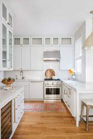 Sep 22, 2019 · grey stained wood cabinets look super modern and the black and wood shelving along with the wood panelled ceiling lend this kitchen an industrial feel. How To Use Wallpaper In Your Kitchen Centered By Design
