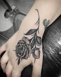 It's softer and more delicate than some of the bolder designs on this list. Top 65 Rose Tattoo Ideas Beautiful Tattoo Designs 2021