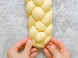 Twelve humps from two small or one large braided bread recall the miracle of the 12 loaves for the 12 tribes of israel. How To Braid Challah Learn To Braid Dough Like A Pro